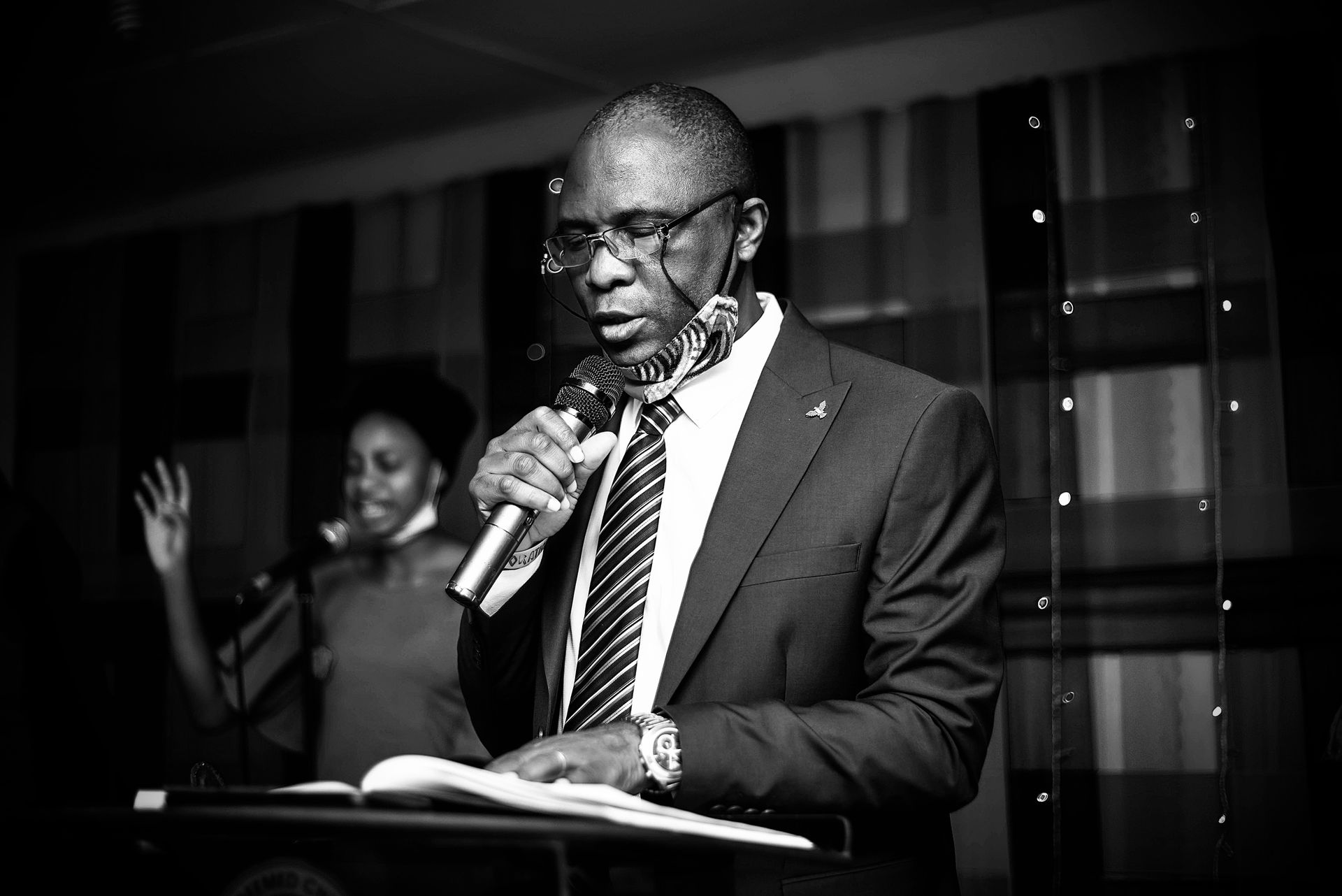 A Nigerian executive in formal dress addressing an industry audience